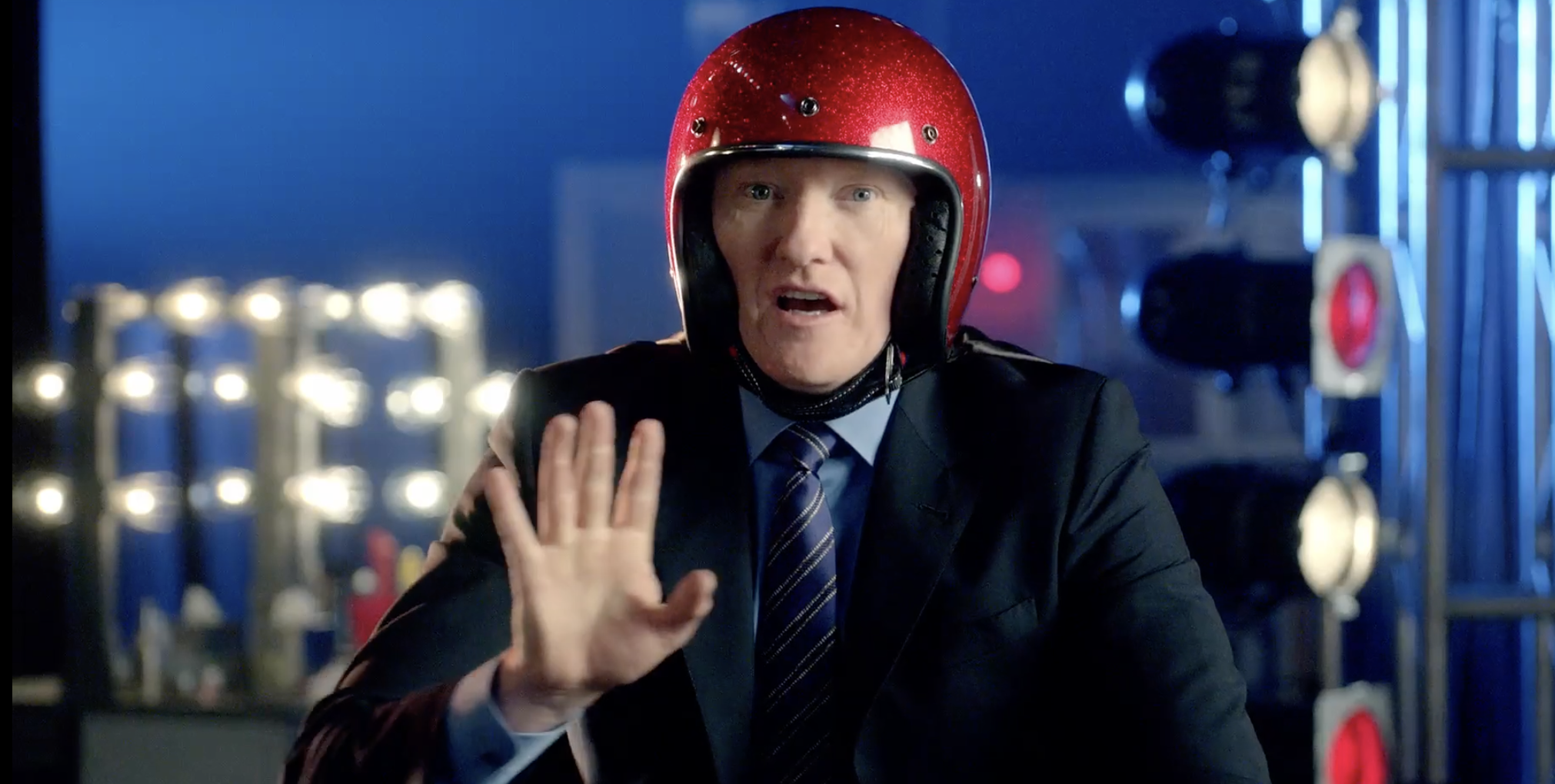 Conan O’Brien wearing a red helmet in a Movie Awards spot