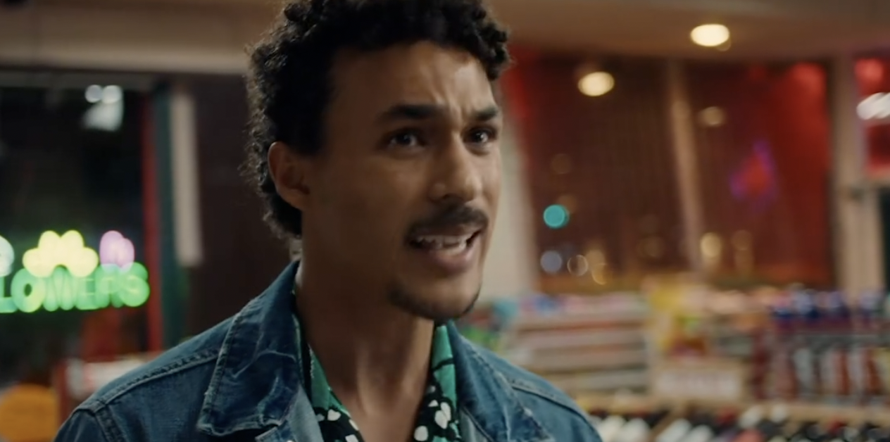 Man speaking in a brightly lit store